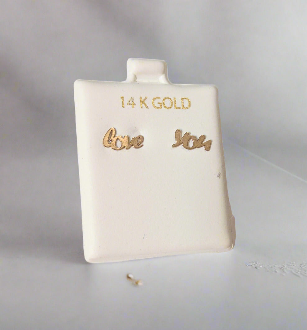 Gold earrings pair of earrings Love and You are separately featured 1 for each ear. The backs are silicone with 14 KT gold.