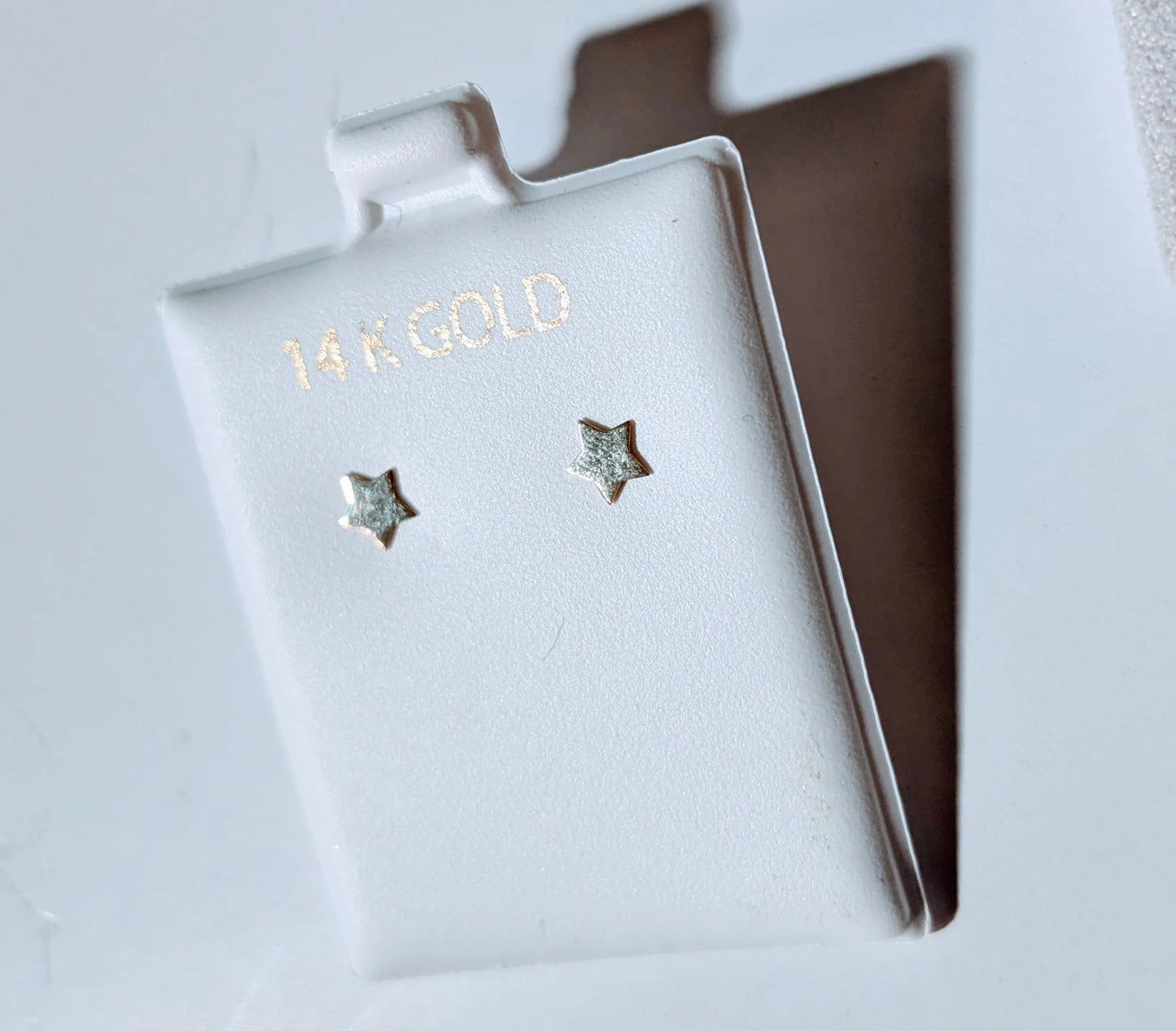 Flat polished 14 KT gold star push back earrings