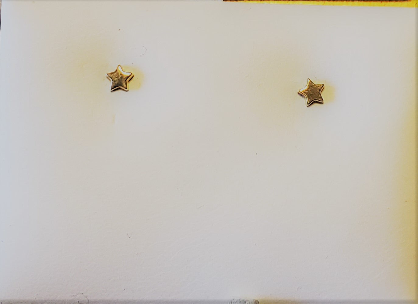 14 KT Petite flat star 3mm. yellow gold post and clutch backs with gift box.