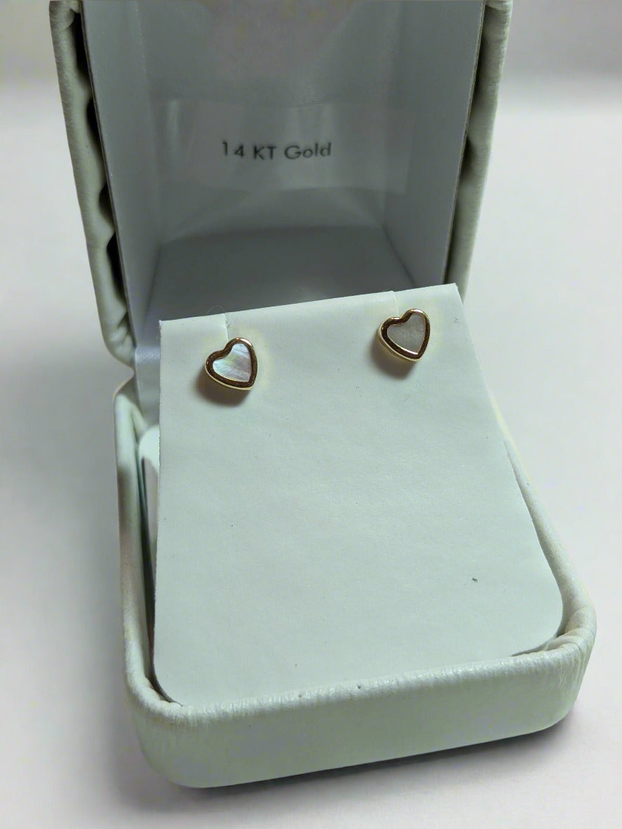 Faux mother of pearl trimmed in 14 KT gold with 14 KT post and screw backs.