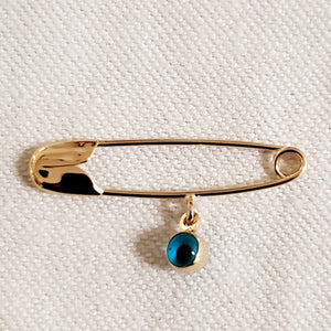 14 KT Diaper Pin with glass eye charm.