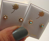 14 KT Gold daisy flower with pearl or turquoise pearl center stone screw on backs.