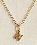 14 KT Paperclip chain with tiny diamond prong set letter pendant charm.  16 inch chain with lobster clasp. 